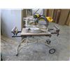 Image 1 : DEWALT DW708 12" SLIDING COMPOUND MITRE SAW ON DELTA FOLDING MOBILE STAND