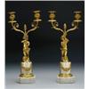 Image 1 : PAIR OF FRENCH GILT BRONZE TWO-LIGHT CANDELABRA, each with a putto supporting a torchere raised o...