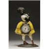 Image 1 : AMERICAN CAST IRON 'TOPSY' BLINKING CLOCK, the polychromed female figure wearing a blouse, skirt...