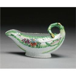 WORCESTER COS LETTUCE LEAF SAUCE BOAT, moulded as green and yellow edged overlapping leaves with...