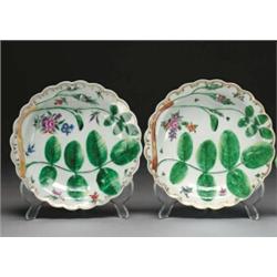 TWO WORCESTER 'BLIND EARL' PLATES, each moulded and painted in colours with a budding rose branch...