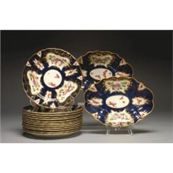 ROYAL WORCESTER SERVICE, with moulded rims painted in colours with insects and exotic birds in pa...