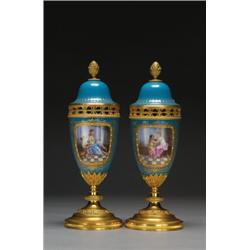 PAIR OF 'SEVRES' GILT BRONZE MOUNTED VASES AND COVERS, each painted in colours with a panel of a...