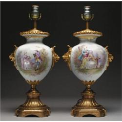 PAIR OF 'SEVRES' GILT-BRONZE MOUNTED TABLE LAMPS, painted in colours with a panel of a courting c...