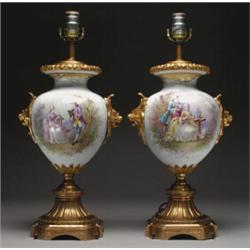 PAIR OF 'SEVRES' GILT-BRONZE MOUNTED TABLE LAMPS, painted in colours with a panel of a courting c...