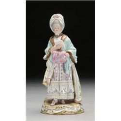 MEISSEN FIGURE OF A WOMAN, painted in colourful costume, standing reading a letter and holding a...