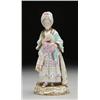 Image 1 : MEISSEN FIGURE OF A WOMAN, painted in colourful costume, standing reading a letter and holding a...