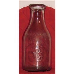 Old glass bottle registry marked P with bottom embossed: NOT TO BE SOLD; about 10 in high