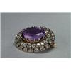 Image 1 : 14K YELLOW GOLD AND SILVER BROOCH, centering an oval cut amethyst within 2 circles of 40 old cut...