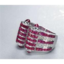 18K WHITE GOLD OPEN BAND, formed as a scroll channel set with 90 square cut rubies (approx. 6.00c...