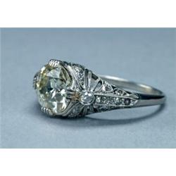 PLATINUM FILIGREE RING, set with an old European cut diamond (approx. 2.78ct.) in a mount decorat...