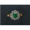 Image 1 : 18K YELLOW GOLD AND PLATINUM RING, bezel set with an emerald cut emerald (approx. 0.64ct.) encirc...