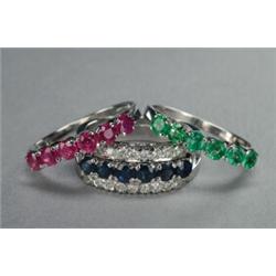 18K WHITE GOLD RING SUITE, the outer ring set with 18 small brilliant cut diamonds, with 3 interc...