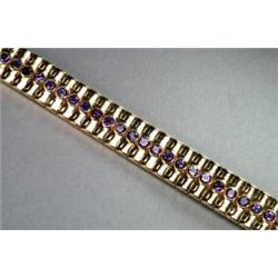 18K YELLOW GOLD BRACELET, bezel set with a row of 43 full cut amethysts, See illustration, Es...
