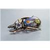 Image 1 : 14K YELLOW GOLD AND SILVER BROOCH, realistically formed as a beetle set with 17 various round cut...