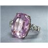 Image 1 : 18K WHITE GOLD COCKTAIL RING, set with a fancy cushion cut kunzite (approx. 20.50ct.) flanked by...