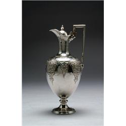 VICTORIAN SILVER CLARET JUG, the ovoid body chased, engraved and embossed with scrolling foliage,...