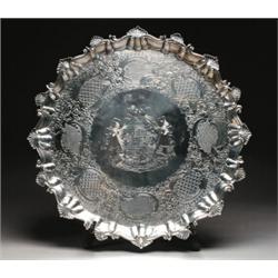 GEORGE III SILVER LARGE SALVER, of circular shape with moulded scroll and shell rim, the centre e...