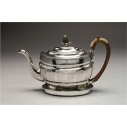 GEORGE III SILVER TEAPOT AND STAND, of facetted oval form with wooden handle and pineapple finial...