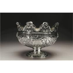 GEORGE III SILVER MONTEITH, the shaped rim topped by cherub heads, the body embossed, engraved an...