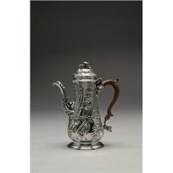 GEORGE II SILVER COFFEE POT, the wrythen-fluted baluster body and domed cover repoussT and engrav...