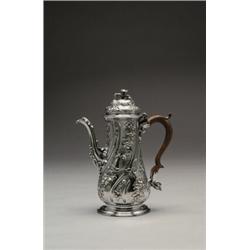 GEORGE II SILVER COFFEE POT, the wrythen-fluted baluster body and domed cover repoussT and engrav...