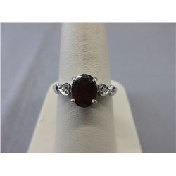 2.10 CT "Oval Garnet" Ring set with 2 Diamonds