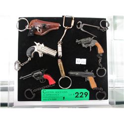 5 Vintage key chain cap guns & 2 bullet key chains