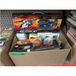 Box of new Olympic glassware & used toys