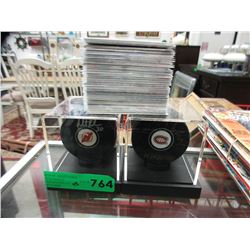 2 Autographed hockey pucks & 40 hockey cards