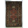 A SHIRVAN RUG, Caucasian, early 20th century, a pale red double keyhole motif medallion on a navy...