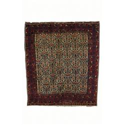 AN AFSHAR RUG, south Persian, c.1920, a floral lattice in red, blue and light blue on an ivory fi...