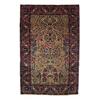 A LAVAR KERMAN RUG, southeast Persia, c.1900, an ivory ground field sprouting flowering tree of l...