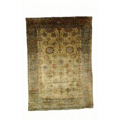 A SILK TABRIZ RUG, northwest Persia, c.1880, an ivory ground allover sha-abbas feild in muted lig...