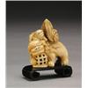 Image 1 : AN IVORY KARASHISHI GROUP, the mother grasping an openwork ball, a pup to her back, Chounsai Shom...