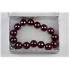 Image 1 : SEASHELL PEARL BRACELET - DARK RED