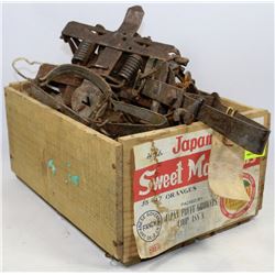ORANGE CRATE WITH ASSORTED TRAPS