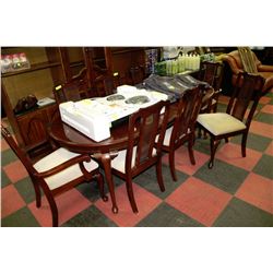 TABLE WITH 2 LEAVES AND 8 WOOD AND WICKER CHAIRS