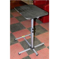 ADJUSTABLE TABLE