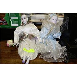 PAIR OF PORCELAIN DOLLS
