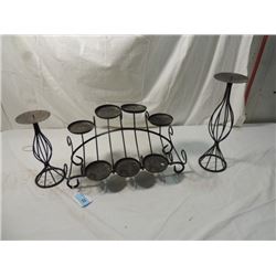 THREE BLACK WROUGHT IRON CANDLE HOLDERS