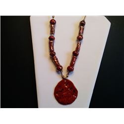 HANDCRAFTED CERAMIC NECKLACE ON SILK CORD