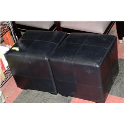PAIR OF BLACK OTTOMANS