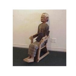 Folk Art: South Sulawesi Island, SEATED EFFIGY, carved wood figure of a seated woman with cloth...