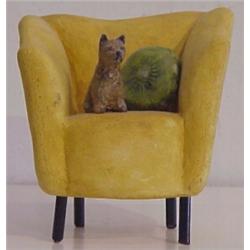 Nancy Rehg (20th Century) American, YELLOW CHAIR WITH TERRIER, acrylic painted ceramic sculptur...