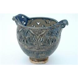 A large Martinware twin-handled bowl, the pierced body decorated with bands of flowers, the middl...