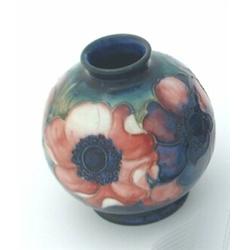 A Moorcroft vase, of circular shape, the blue-green ground decorated with anemones, inscribed mar...