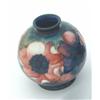 Image 1 : A Moorcroft vase, of circular shape, the blue-green ground decorated with anemones, inscribed mar...