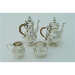 A four-piece Queen Anne style silver tea set, with cane handles, Sheffield 1904, 44 ozs gross, to...