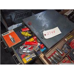 Metal Cabinet Full of New Spark Plugs